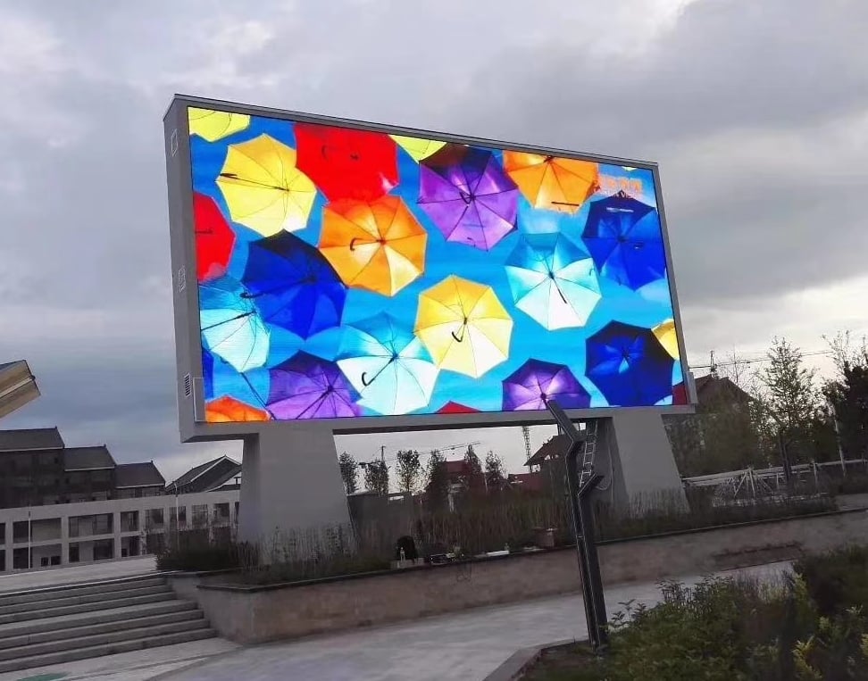Outdoor LED billboard standing in a public plaza in daylight