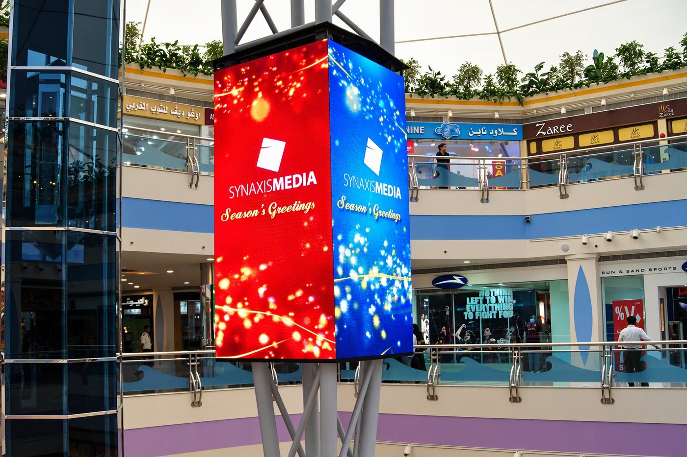Four-sided LED display wrapping a column in a shopping mall